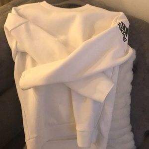 Adidas white sweatshirt.